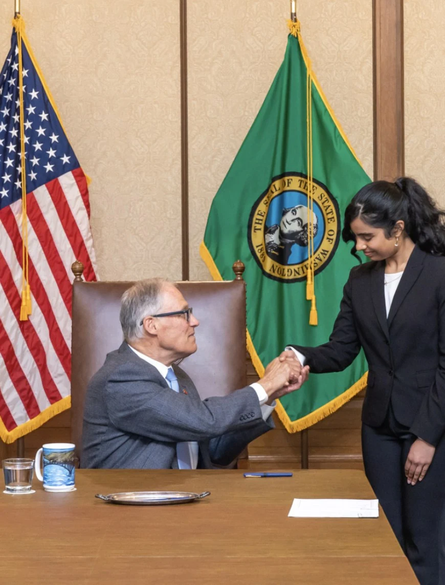Ria Bahadur with Governor Jay Inslee at the signing of SB 5355