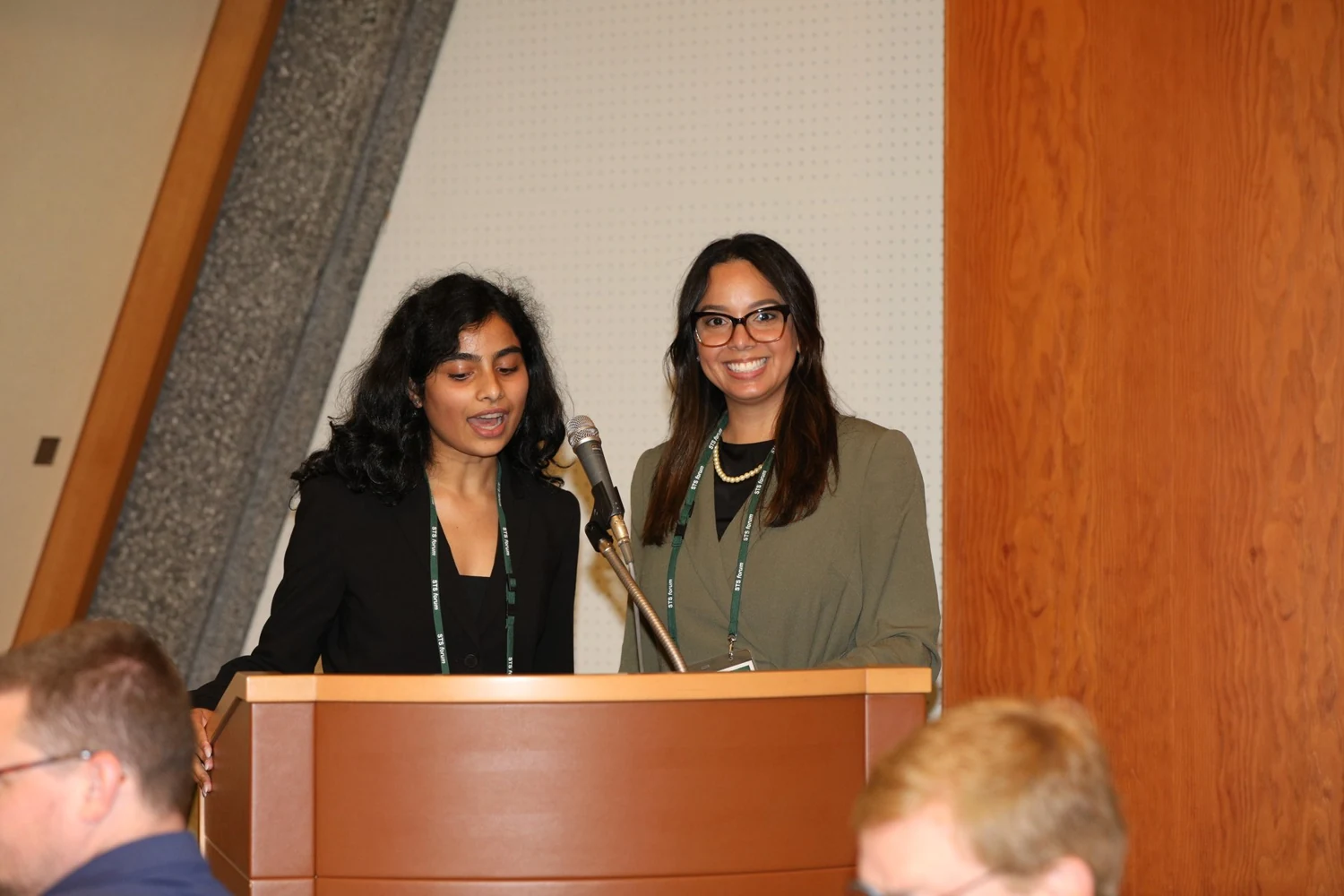 Ria Bahadur and a fellow rapporteur at an STS Forum podium